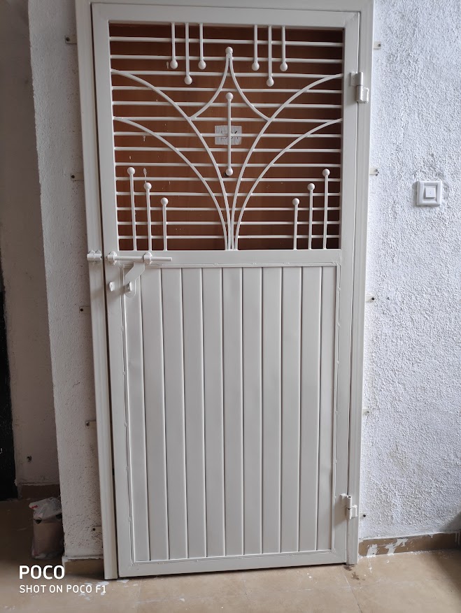 A robust and secure safety door designed for a commercial shop front.